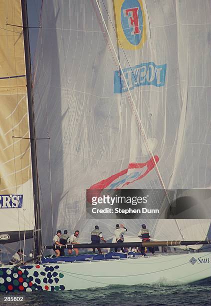 THE CREW OF ONE AUSTRALIA, AUS 31, LOWERS THE SPINAKER AFTER CROSSING THE FINISH LINE IN THEIR OPENING RACE AGAINST THE NIPPON CHALLENGE IN THE LOUIS...