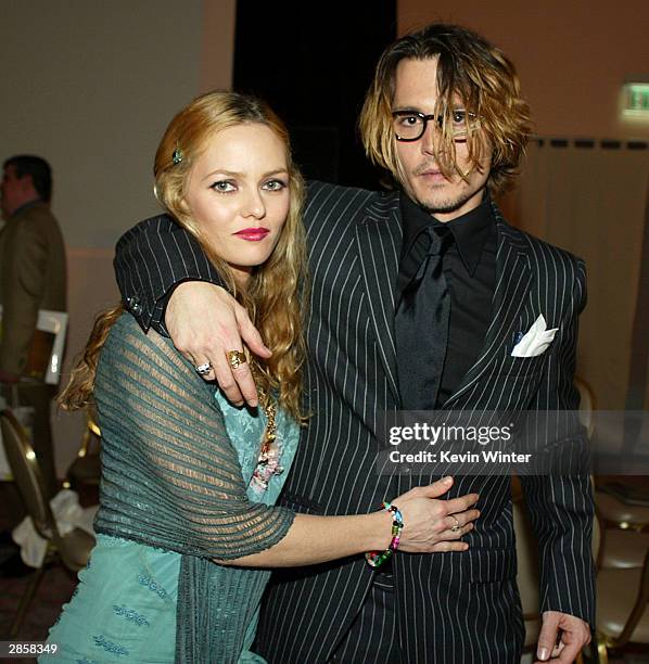 Actor Johnny Depp and girlfriend Vanessa Paradis pose after The 9th Annual Critic's Choice Awards at the Beverly Hills Hotel on January 10, 2004 in...