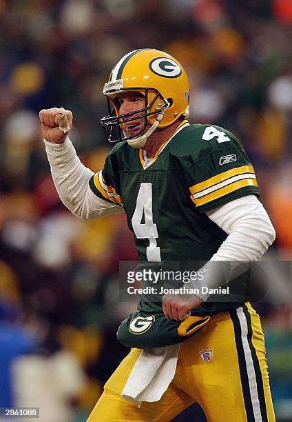 Quarterback Brett Favre of the Green Bay Packers celebrates against the Seattle Seahawks in the NFC Playoff game on January 4, 2004 at Lambeau Field...