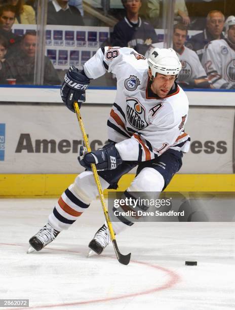 Left wing Ethan Moreau of the Edmonton Oilers controls the puck during the game against the Toronto Maple Leafs at Air Canada Centre on November 8,...