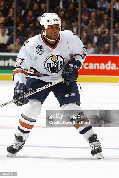 Right wing Georges Laraque of the Edmonton Oilers skates on the ice during the game against the Toronto Maple Leafs at Air Canada Centre on November...