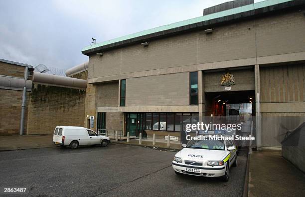 Police car amd a funeral director van leaves Wakefield prison where convicted serial killer Dr Harold Shipman was found dead hanging in his cell on...