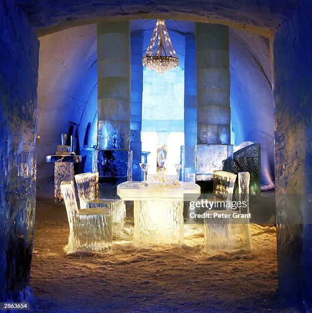 Chandelier hangs above a dining table at the Ice Hotel January, 2002 in Jukkasjarvi, Sweden. The 30 000 square foot hotel is constructed anew every...