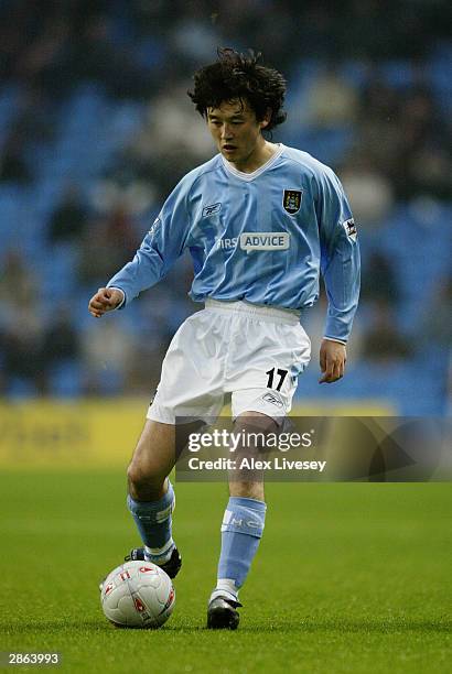 Sun Jihai of Manchester City passes the ball during the FA Cup third round match between Manchester City and Leicester City on January 3, 2004 at the...