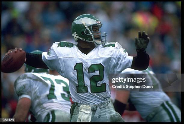 PHILADELPHIA EAGLES QUARTERBACK RANDALL CUNNINGHAM LOOKS TO PASS DOWNFIELD DURING THE EAGLES 23-21 VICTORY OVER THE PHOENIX CARDINALS AT SUN DEVIL...