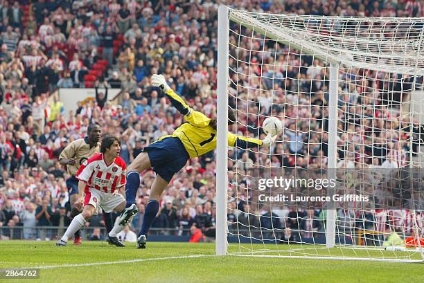 David Seaman of Arsenal makes a spectacular save to keep the ball out during the FA Cup Semi-Final match between Arsenal and Sheffield United held on...