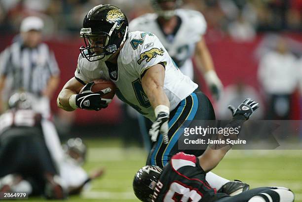 Fullback Marc Edwards of the Jacksonville Jaguars carries the ball against the Atlanta Falcons during the game at the Georgia Dome on December 28,...