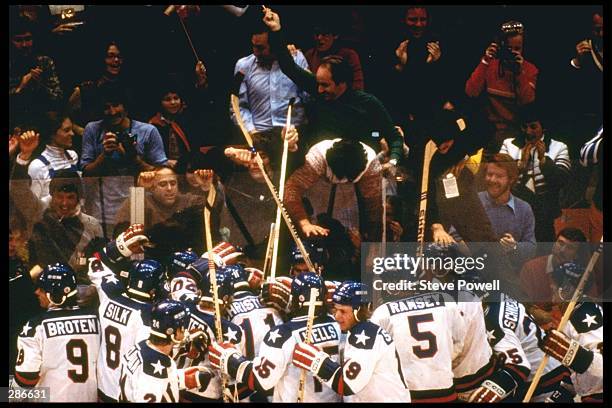 The USA Team celebrates their 4-3 victory over Russia in the semi-final of the Ice Hockey competition of the 1980 Winter Olympic Games in Lake...