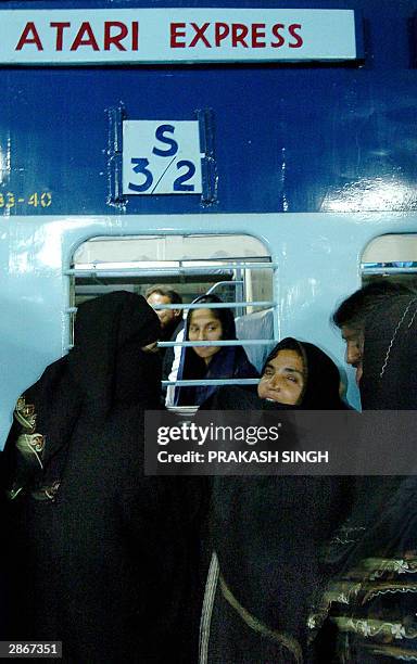 An unidentified woman says her farewells to her relatives as the Atari Express train departs from Old Delhi Railway Station, 14 January 2004. The...