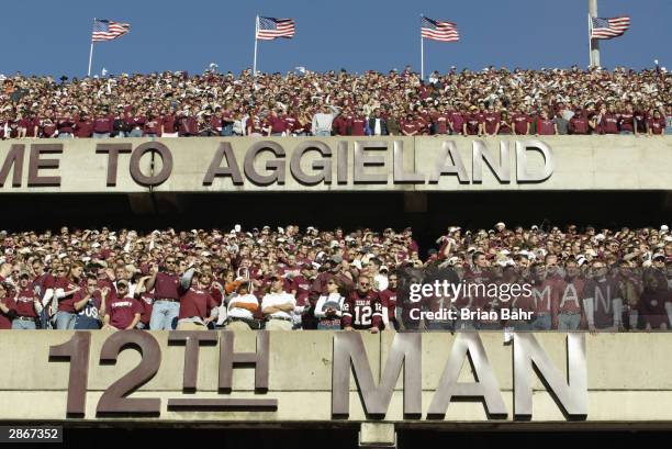 Texas A&M University Aggies fans, sometimes referred to as the 12th Man, stand during the game against the University of Texas at Austin Longhorns,...