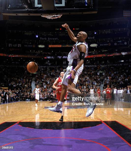 Vince Carter of the Toronto Raptors dunks the ball during the NBA game against the Cleveland Cavaliers at Air Canada Centre on January 7, 2004 in...