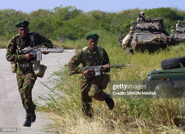 Kenyan military troops and US marines carry out a joint military exercise 15 January 2004 in Manda bay near the coastal town of Lamu. AFP PHOTO/SIMON...