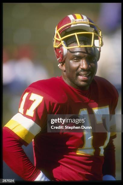 Quarterback Doug Williams of the Washington Redskins takes a photo opportunity during a game with the Arizona Cardinals at the Sun Devil Stadium in...