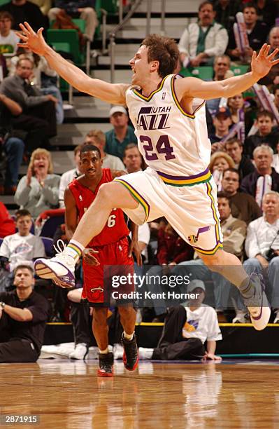 Raul Lopez of the Utah Jazz leaps for a loose ball against the Miami Heat on January 15, 2004 at the Delta Center in Salt Lake City, Utah. They Jazz...