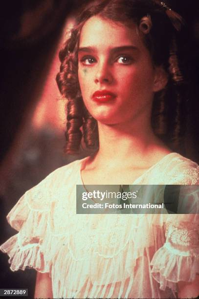 American actor Brooke Shields wears a ruffled blouse and heavy makeup in a still from the film, 'Pretty Baby,' directed by Louis Malle, 1978.