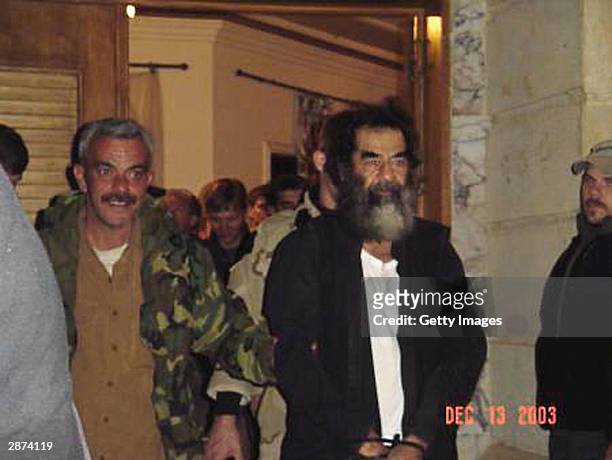 This unsourced picture alleges to show Iraqi leader Saddam Hussein in an unknown location in Iraq after his capture by US troops on December 13, 2003...