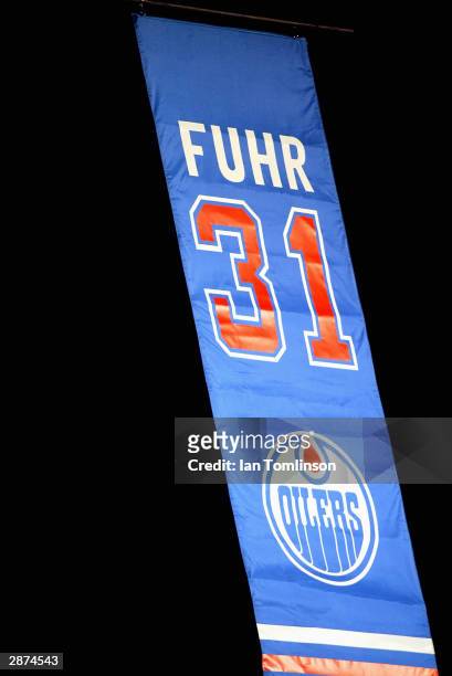 Hall of Fame goaltender Grant Fuhr's number 31 is raised to the rafters before a crowd of 16,839 in a ceremony to retire his uniform number by the...