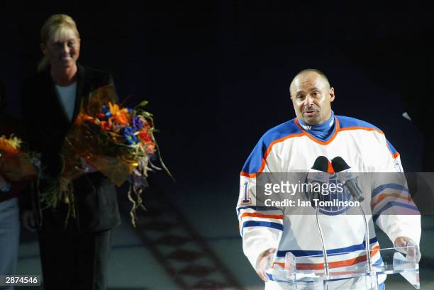 Hall of Fame goaltender Grant Fuhr speaks to the crowd of 16,839 during a ceremony to retire his number 31 by the Edmonton Oilers before the game...