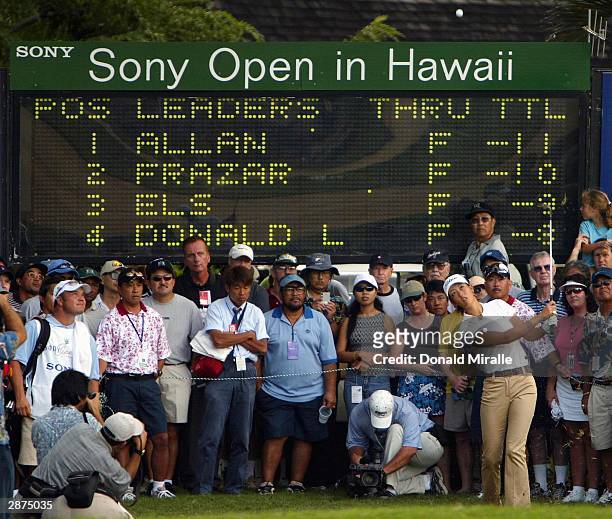 Year-old Michelle Wie hits the ball out of the rough admist the gallery on the 9th hole during the Sony Open on January 16, 2004 at the Waialae...