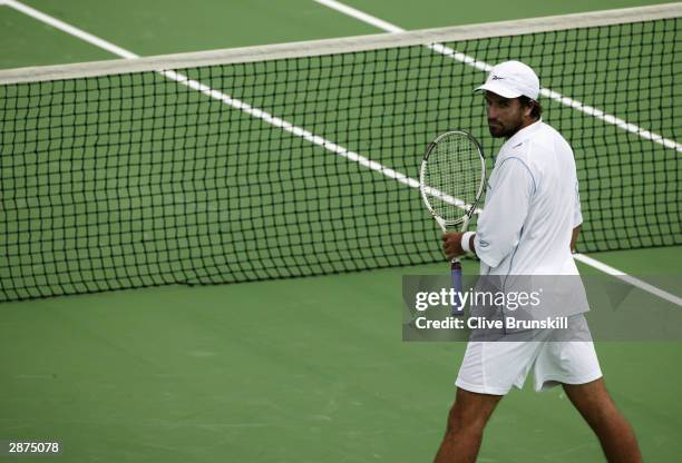 Pat Rafter of Australia watches on during his doubles match with partner Josh Eagle at the Commonwealth Bank International at Kooyong Lawn Tennis...