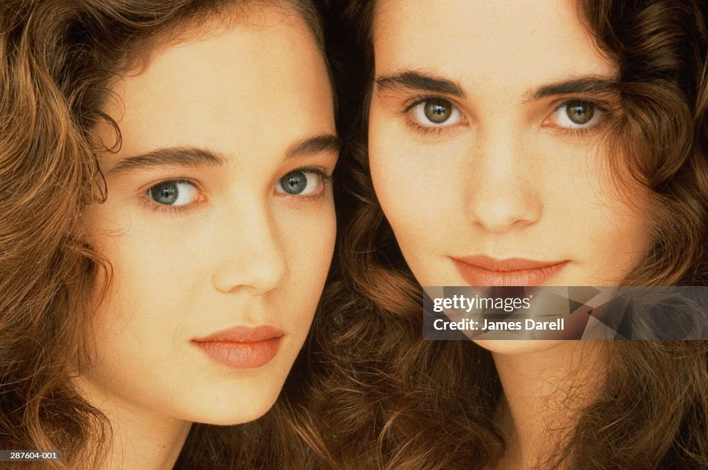 Two women with dark hair, portrait, close-up