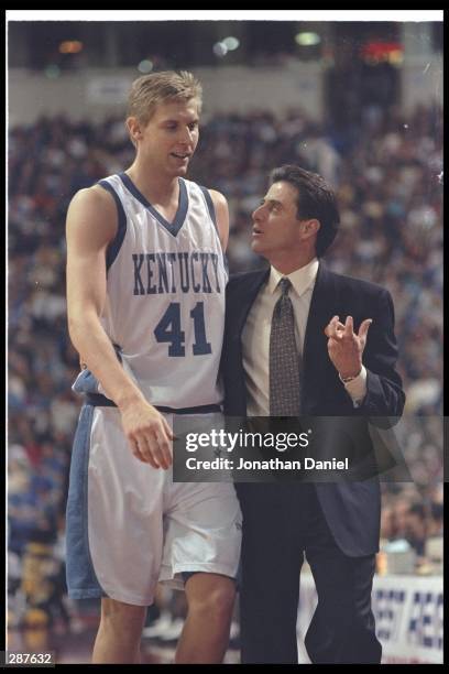 Head coach Rick Pitino of the University of Kentucky talks to player Mark Pope of the Kentucky Wildcats during their 83-63 victory over Wake Forest...