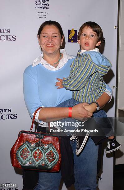 Actress Camryn Manheim and her son Milo arrive at the 2nd Annual "Stars With Sticks" Celebrity Hockey Game at the Health South Training Center on...