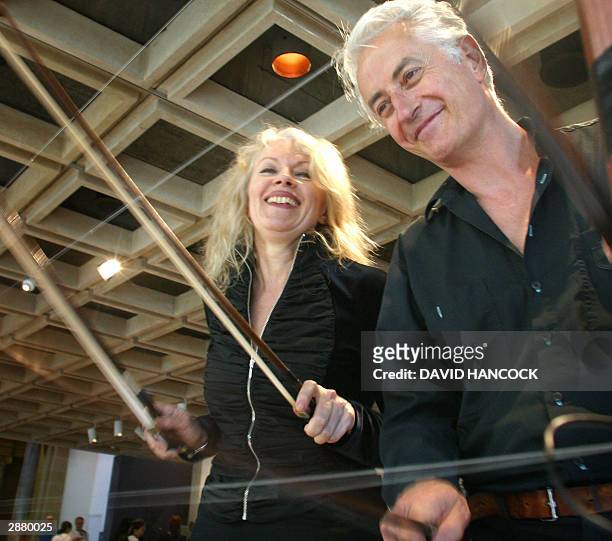 Virtuoso violinists Hollis Taylor and John Rose play a fence installation at the Art Gallery of New South Wales in Sydney, 19 January 2004. The pair...