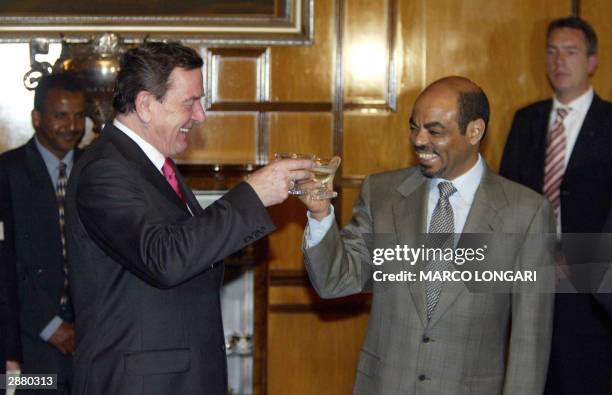 German Chancellor Gerhard Schroeder shares a toast with Ethiopian Prime Minister Meles Zenawi after signing an investment treaty at the Presidential...