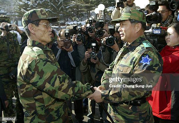 Jun Yong-Il, a South Korean prisoner of war, is greeted by Major General Heo Pyopng-Hwan during a ceremony at the base of the Blue Star 6th Army...