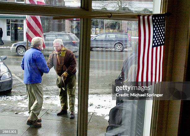 Presidential candidate U.S. Senator Joe Lieberman shakes hands with a man while campaigning on Main Street January 19, 2004 in Hanover, New...