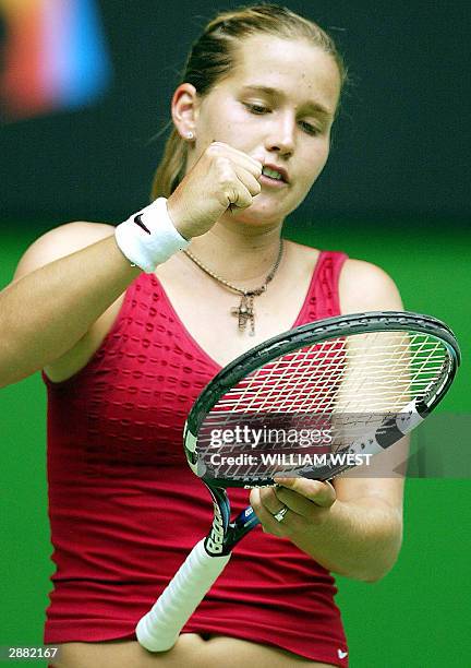 Ashley Harkleroad of the US pounds her racket in frustration during her first round women's singles match against third seeded compatriot Venus...