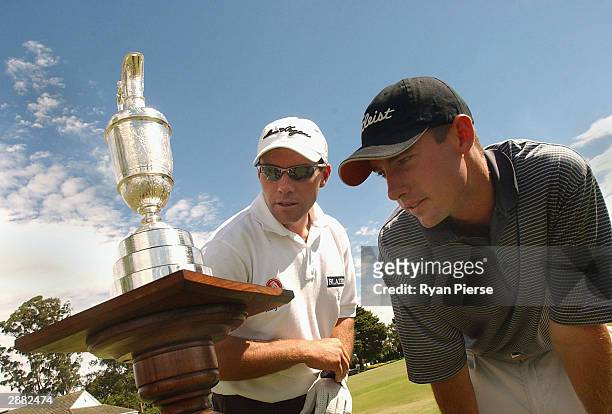 Andrew Tschudin and Andrew Buckle of Australia admire the Claret Jug during Day One of the Australasian Qualifying Leg for the British Open Golf...