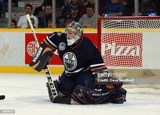 Goalie Ty Conklin of the Edmonton Oilers in net during the game against the Chicago Blackhawks at the Skyreach Centre on November 18, 2003 in...