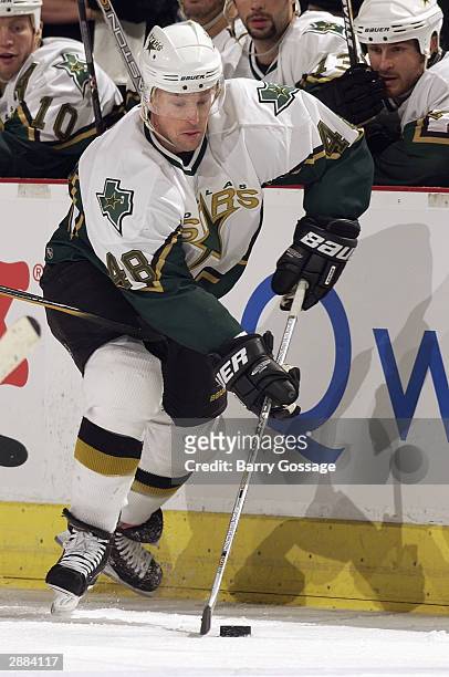 Right wing Scott Young of the Dallas Stars advances the puck during the game against the Phoenix Coyotes at America West Arena on December 10, 2003...
