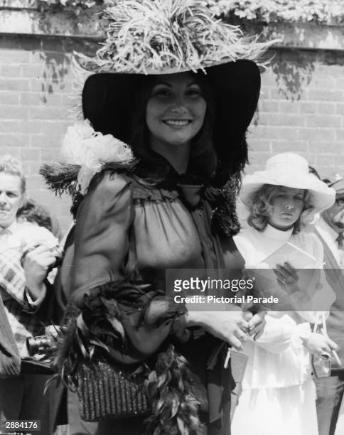 American actor and adult film star Linda Lovelace attends the Ascot races in a sheer black chiffon blouse, England, June 20th 1974.