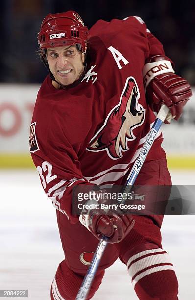 Defenseman Cale Hulse of the Phoenix Coyotes passes the puck during the game against the Dallas Stars at America West Arena on December 10, 2003 in...