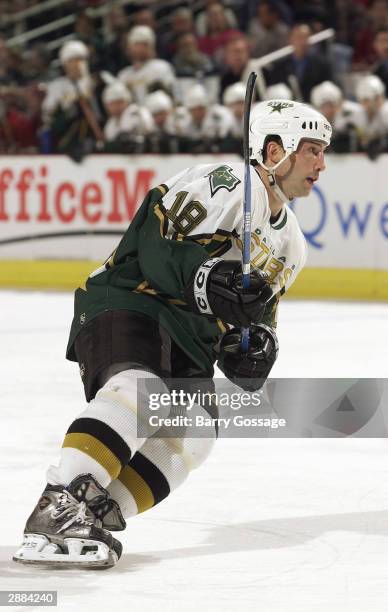 Right wing Rob DiMaio of the Dallas Stars stakes on the ice during the game against the Phoenix Coyotes at America West Arena on December 10, 2003 in...