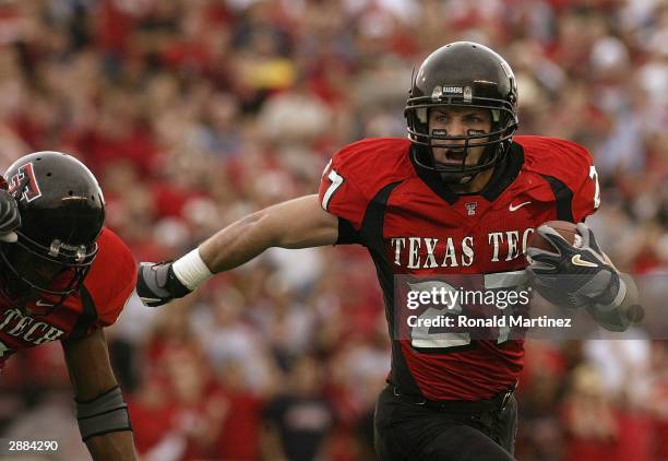 Wide receiver Wes Welker of the Texas Tech Red Raiders carries the ball during the game against the Oklahoma Sooners at Jones SBC Stadium on November...