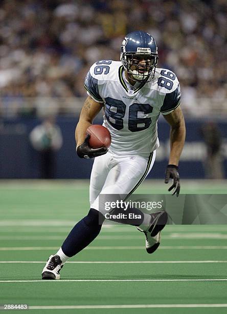 Tight end Jerramy Stevens of the Seattle Seahawks runs with the ball during the game against the St. Louis Rams on December 14, 2003 at the Edward...