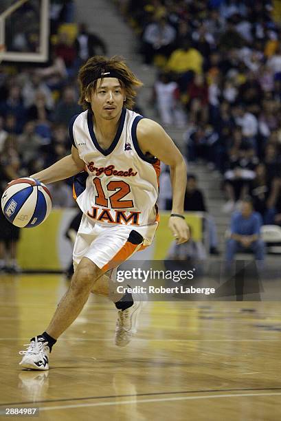 Yuta Tabuse of the Long Beach Jam drives upcourt during the game against the Fresno Heat at The Pyramid on January 16, 2004 in Long Beach,...