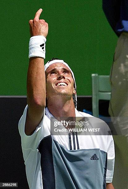 Juan Ignacio Chela of Argentina gestures angrily to the sky during his five-set men's singles second round loss to Taylor Dent of the US at the...