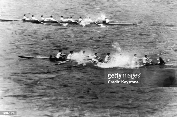 The Oxford boat sinks after only half a mile, during the annual University boat race against Cambridge, 24th March 1951.