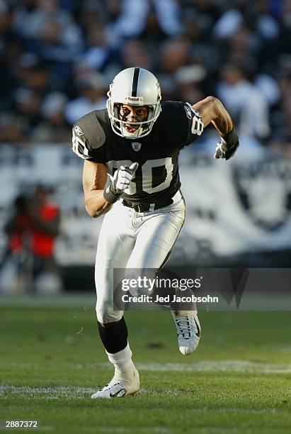 Wide receiver Jerry Rice of the Oakland Raiders heads downfield during the game against the Baltimore Ravens on December 14, 2003 at the Network...