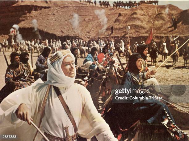 Irish actor Peter O'Toole leads a mounted army in the desert in a still from the film, 'Lawrence Of Arabia,' directed by David Lean, 1962.