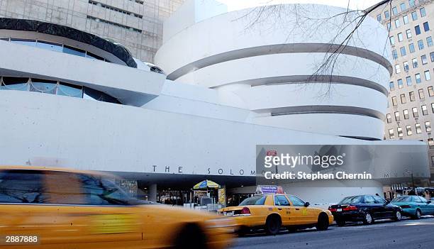 Traffic moves past the front of the Solomon R. Guggenheim Museum January 21, 2004 in New York City. Designed by architect Frank Lloyd Wright, the...