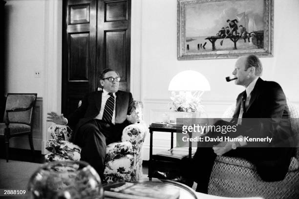 Secretary of State Henry Kissinger and President Gerald Ford talk in the White House residence 1974 in Washington, DC.