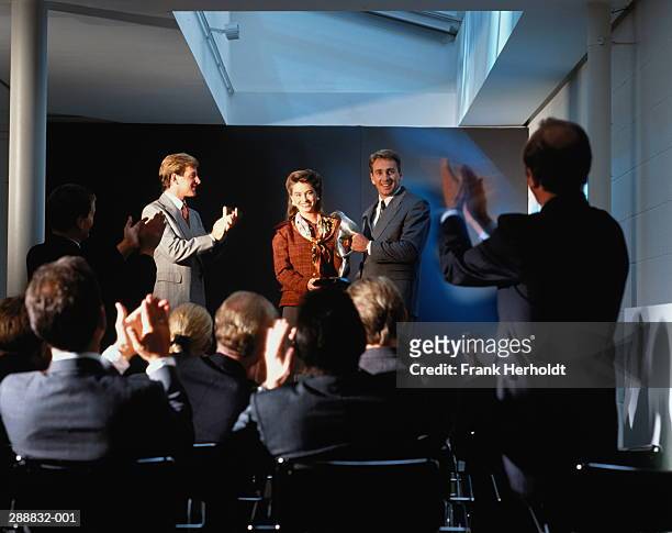 business seminar,man being presented with award - awards ceremony stock pictures, royalty-free photos & images