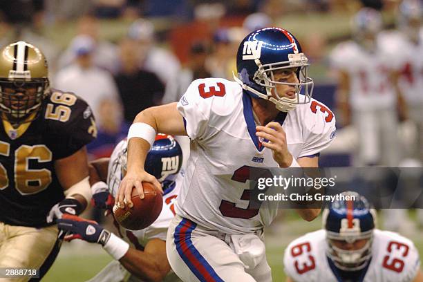 Quarterback Jesse Palmer of the New York Giants scrambles with the ball during the game against the New Orleans Saints on Sunday December 14 at the...