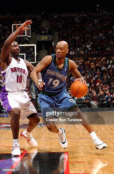 Sam Cassell of the Minnesota Timberwolves drives the lane against Milt Palacio of the Toronto Raptors January 21, 2004 at the Air Canada Centre in...